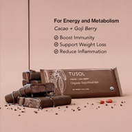 Tusol organic superfood bar with cacao and goji berry on a beige background